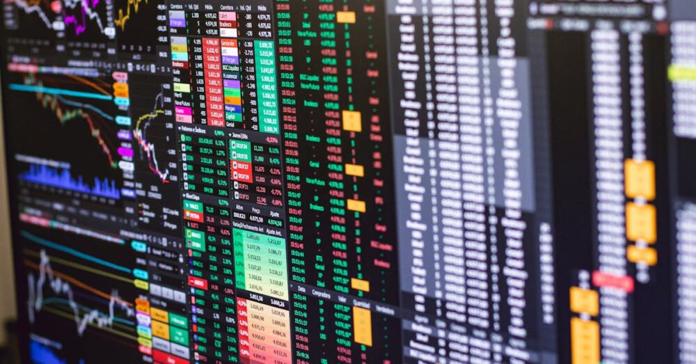 Google Genie 3の発表を受けて激しく変動するゲーム業界の株価チャートと、揺れ動く市場経済のイメージ