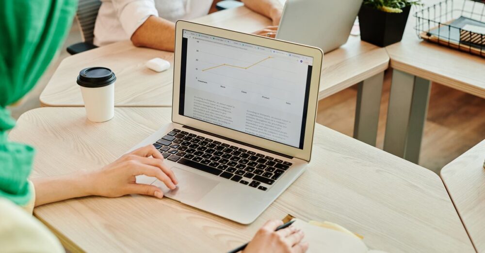 Person using AI tools on laptop for productivity tasks