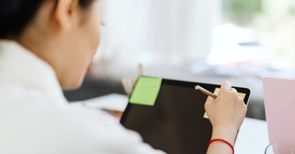 Person using AI tools on laptop for productivity tasks